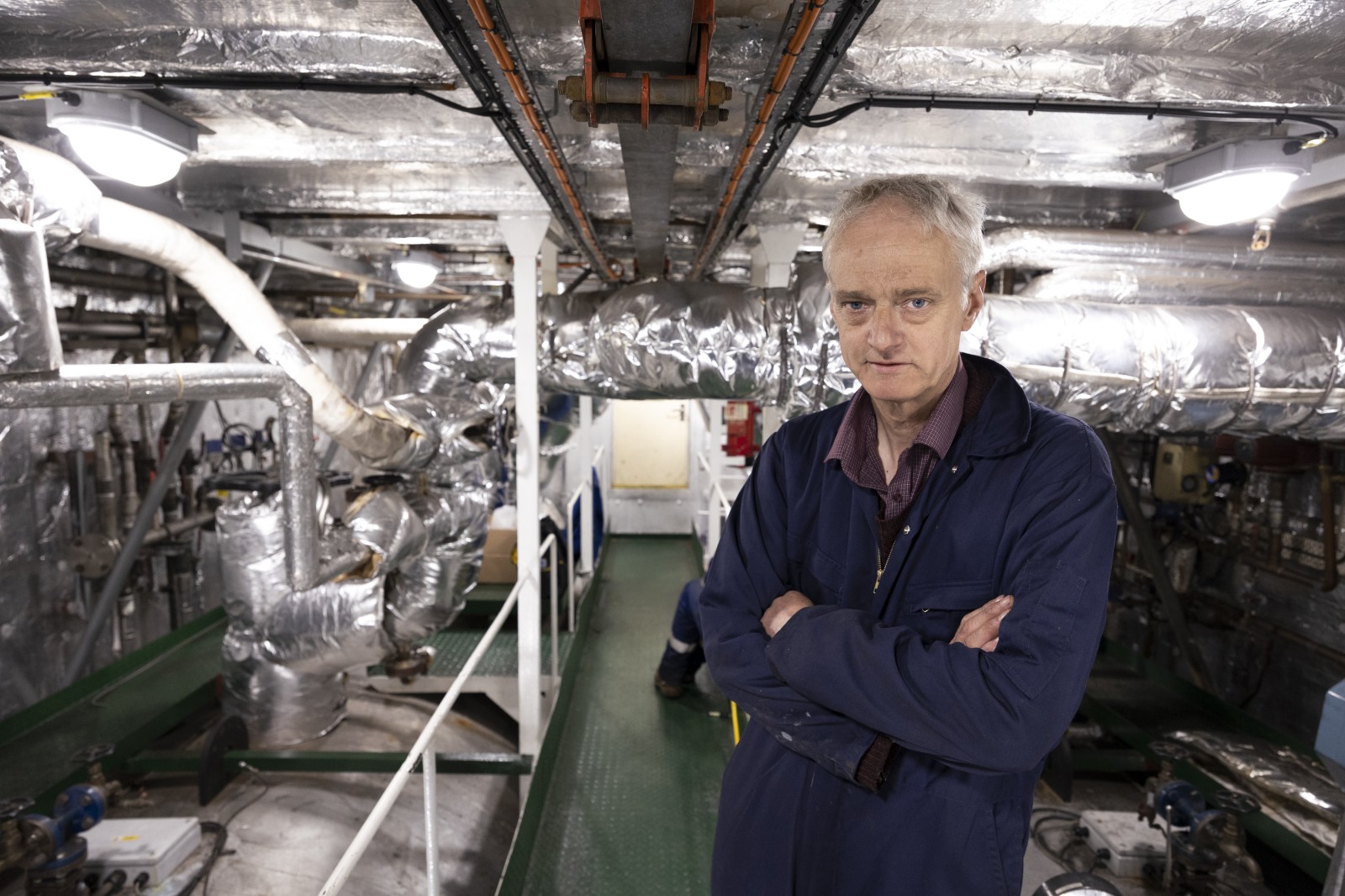 Boiler room fit: Fireman Colin Dykes takes charge of the ship's boiler room. Photograph: Martin Shields