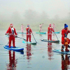 Santas make a splash. Photo: Matthew Hurding / Glasgow Paddleboard Co