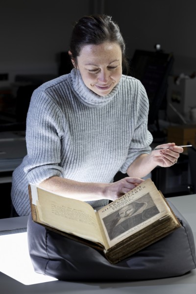 Keira McKee, Book Conservator, with the University of Glasgow’s First Folio copy.   Picture: Photo: Martin Shields