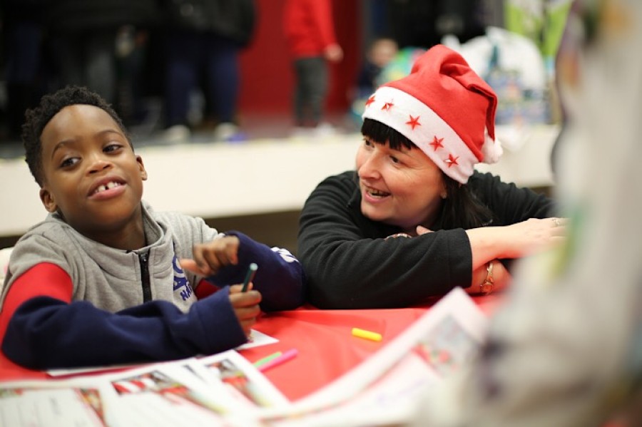  Christmas list: Elliot Osaretin writing his letter to Santa with Cube Housing Officer Debby Beattie