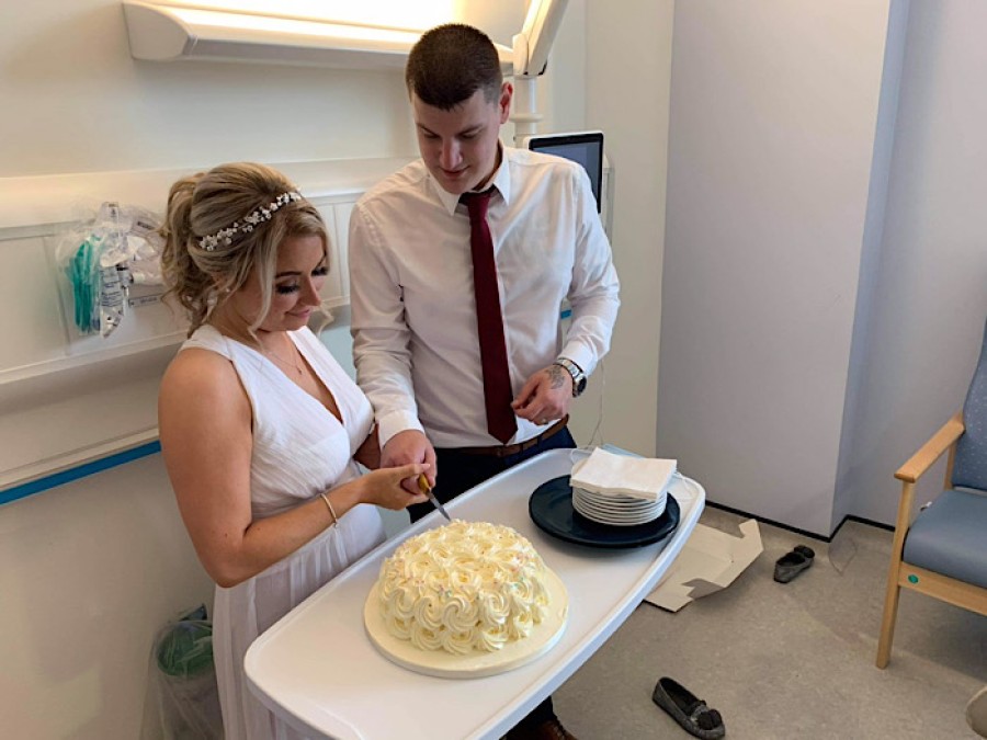  The couple cut the cake in Elizabeth's hospital room after the ceremony. Photo: Natalie Muir