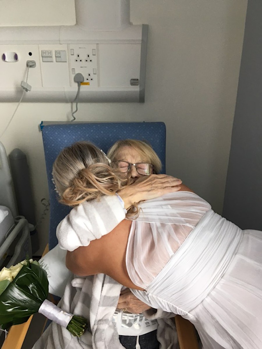  Loving embrace: mother and daughter share a moment on Nicole's big day. Photo: Natalie Muir