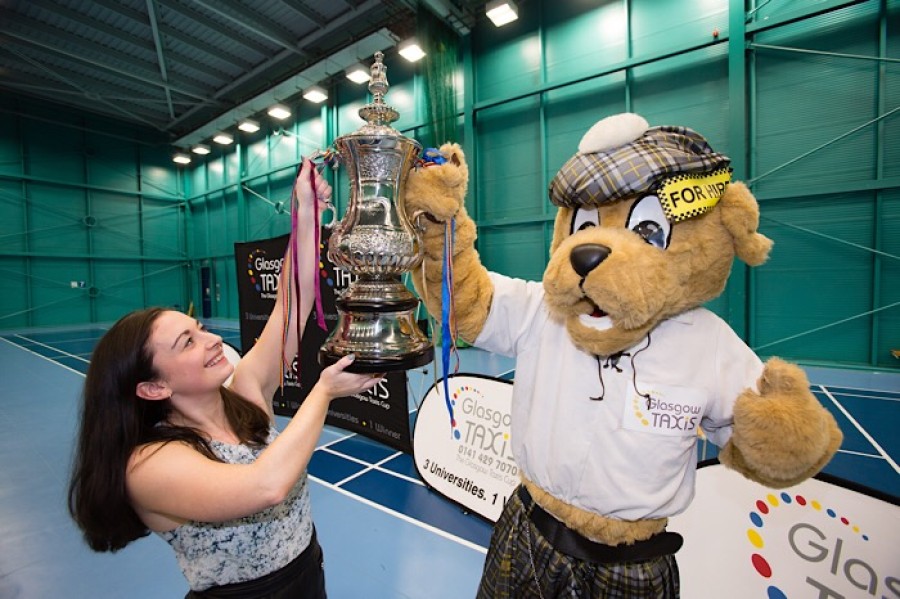  Pictured: Isabella Heath Glasgow University Sports Association’s president holds the trophy up with Glasgow Taxi mascot Rabbie the cabbie. Photographs: Martin Shields