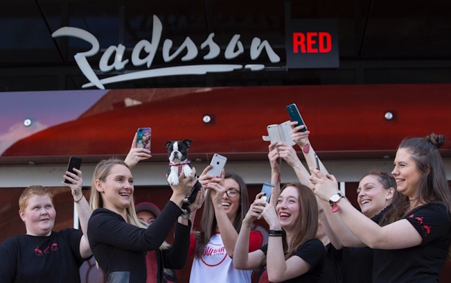  Ashleigh McCormack with hotel mascot Baxter a Boston Terrier puppy enjoying the attention of the Team RED members at the dog friendly hotel as it opens its doors today (30th April 2018) in the city’s West End. Photo © Martin Shields