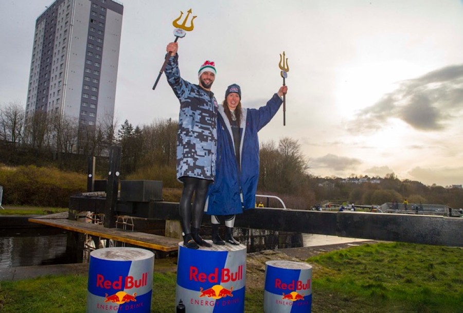  Side by side: Men's and women's winners Erin Jeffrey and Dan Jones on the winners' podium at Red Bull Neptune Steps in Glasgow, UK on March 23, 2019. Photo credit: Jeff holmes/ Red Bull Content Pool / AP