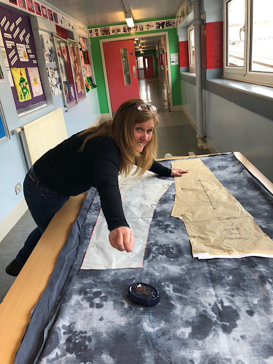  Pinning hope: A volunteer busy at work at Hyndland Secondary School. Photo: Kay Muir