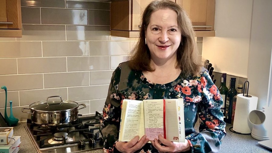 Deborah Murray at home with her cooking journal. Photo: Kevin Murray