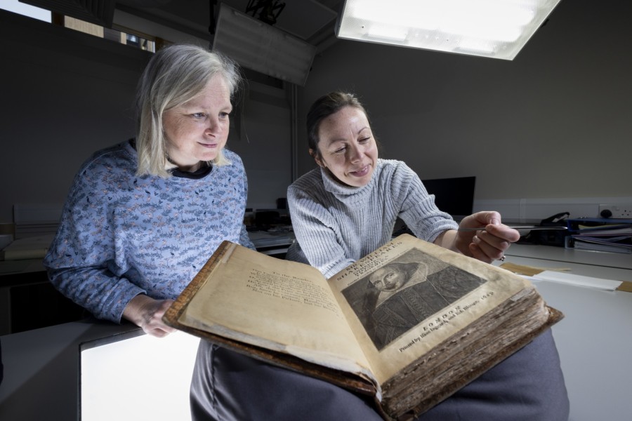 Julie Gardham, Senior Assistant Librarian, and Keira McKee, Book Conservator, with the University of Glasgow’s First Folio copy. Photo: Martin Shields